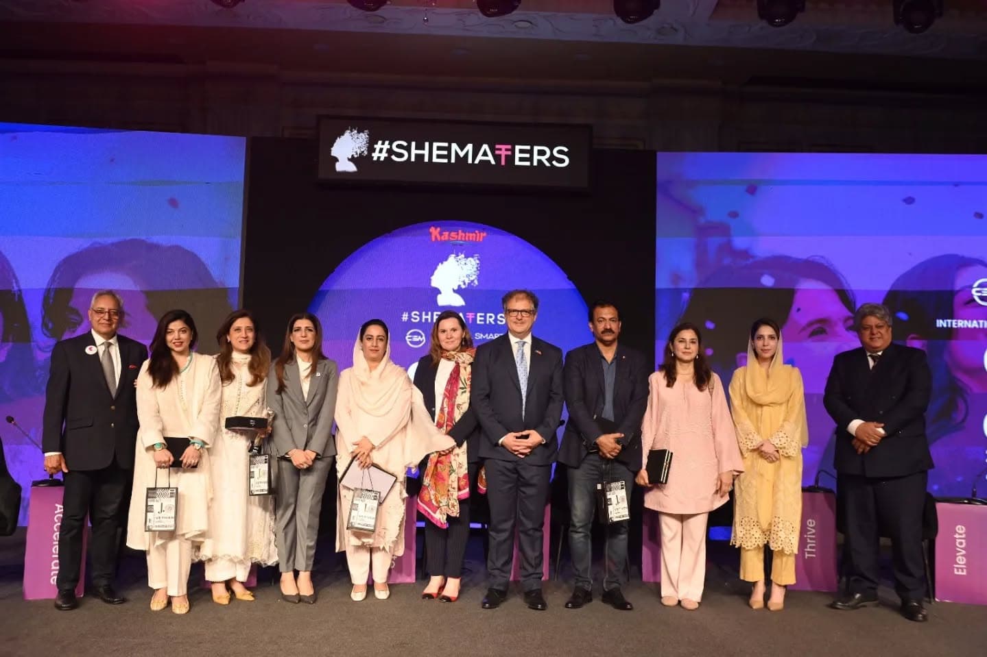 SheMatters IWD 2026 · conference stage